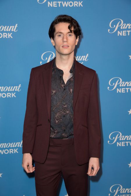 james in a maroon suit and printed shirt on the red carpet 